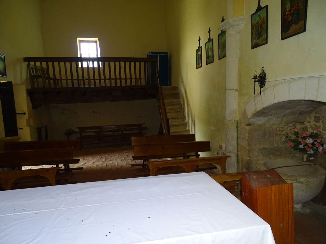 showing the baptismal font in the bottom-right corner of the image