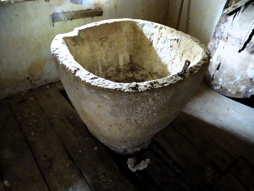 the wooden cover standing against the wall behind