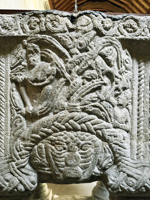 this side may contain a scene involving two human figures surrounded by foliage, etc.