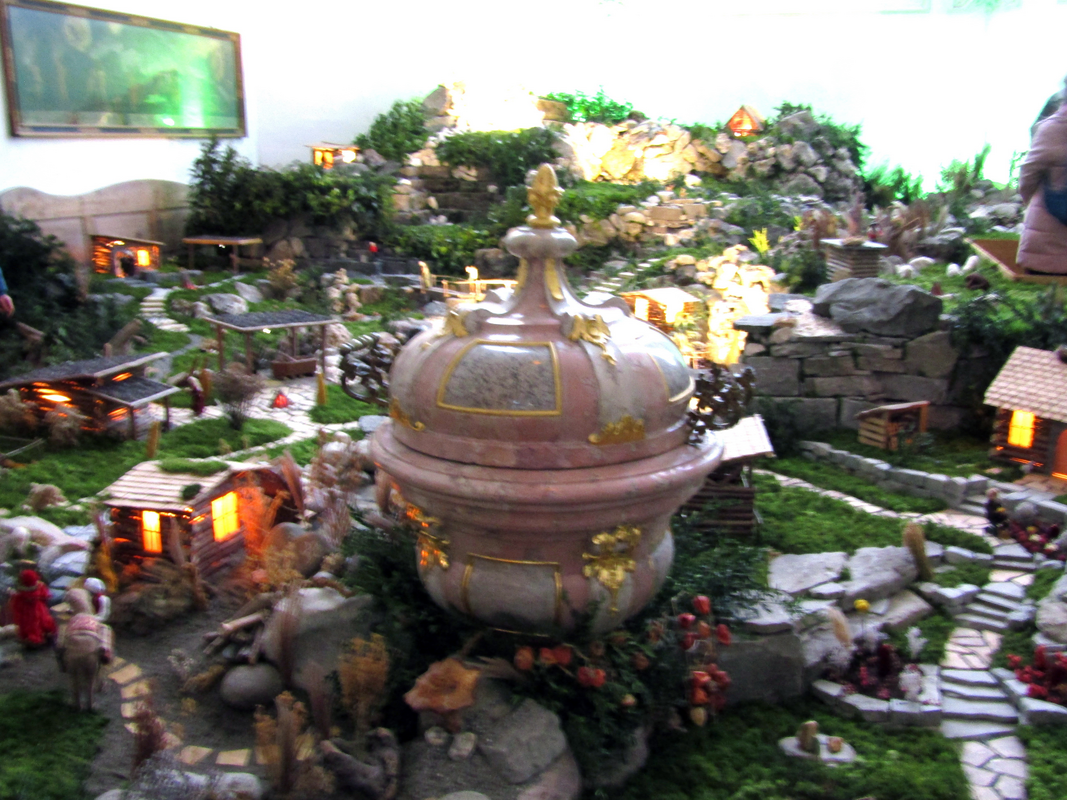 the baptismal font of 1781 surrounded by the Christmas decorations in January of 2025