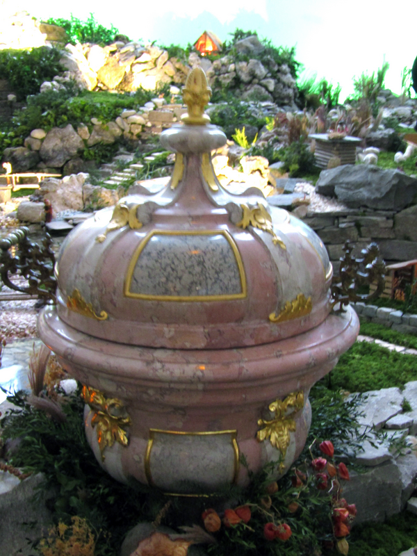 the baptismal font of 1781 surrounded by the Christmas decorations in January of 2025
