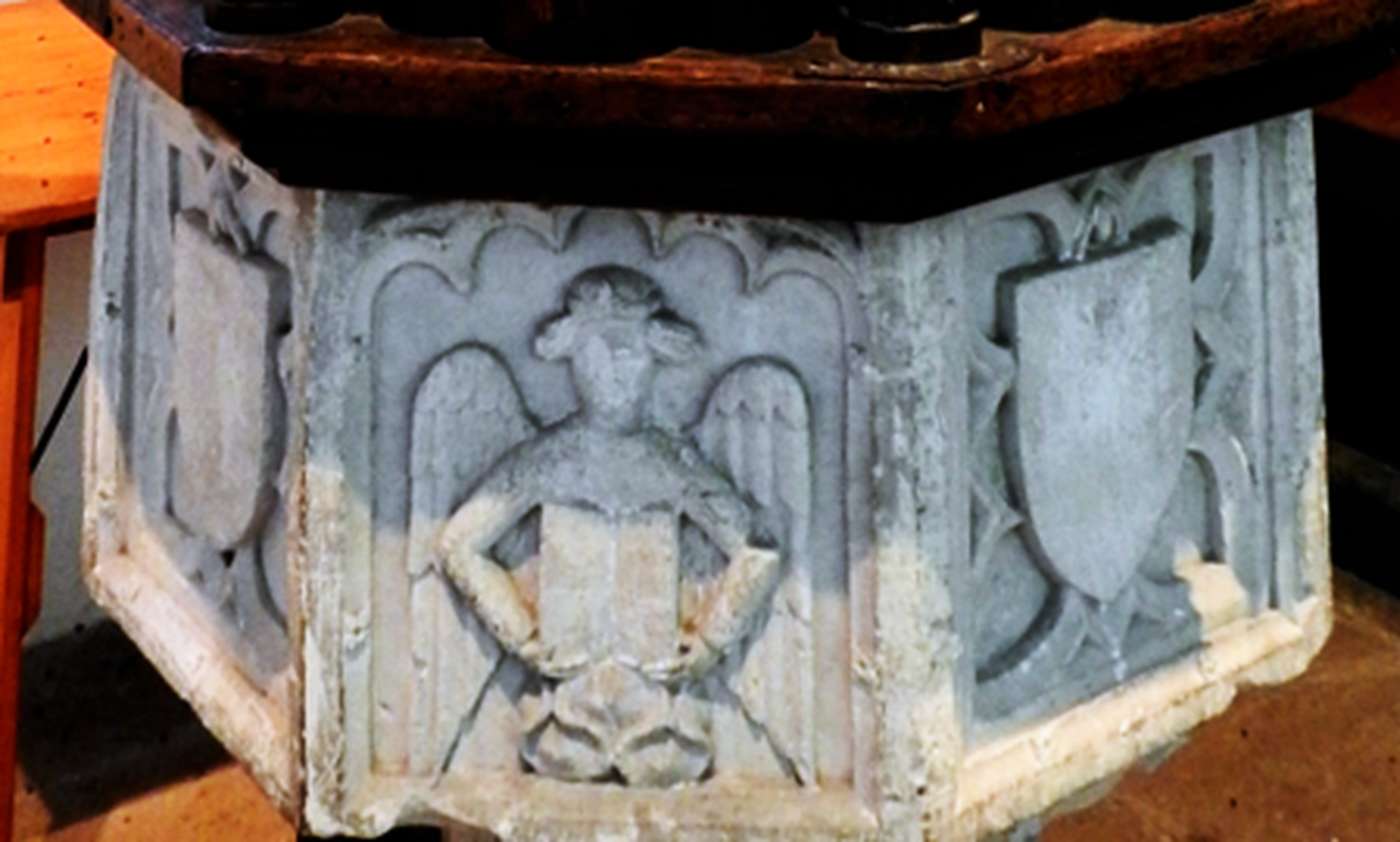 the one on this side holds an open book