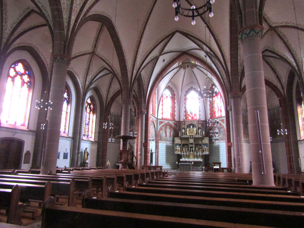 the present font and cover partially visible at the east end of the south aisle