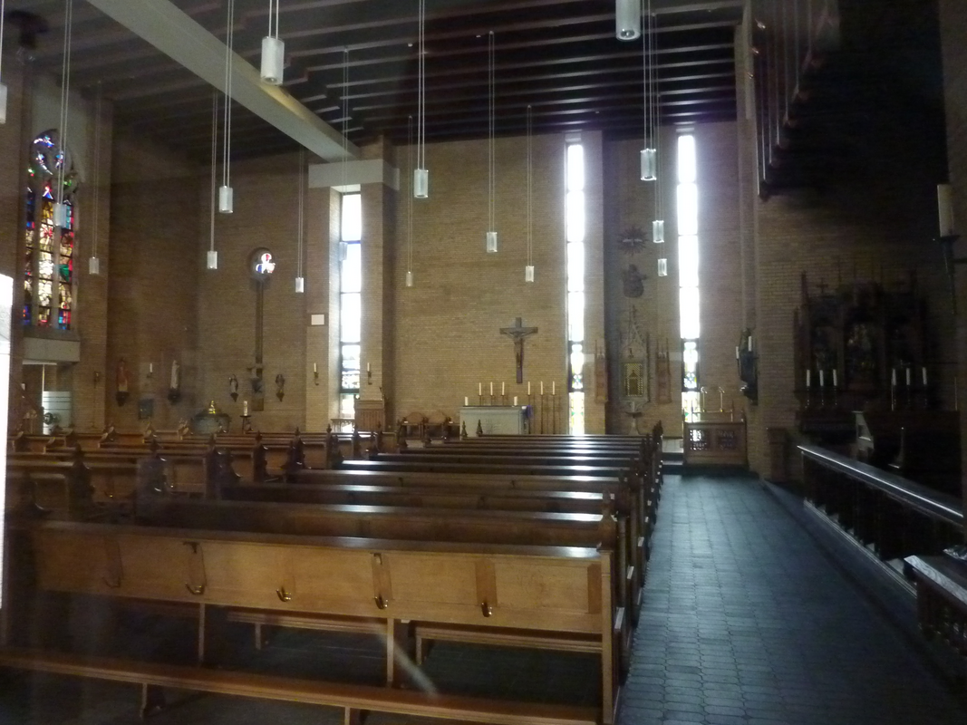 "St. Peter (Königshoven)" -- the modern church; interior showing partially the old font and its cover in the northwest corner [far back, left side]