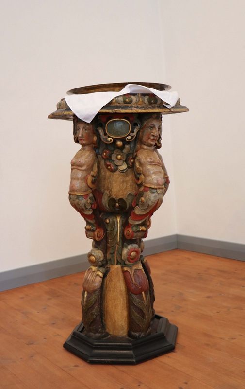 on the sides of the basin, large, handle-like (three or four?]