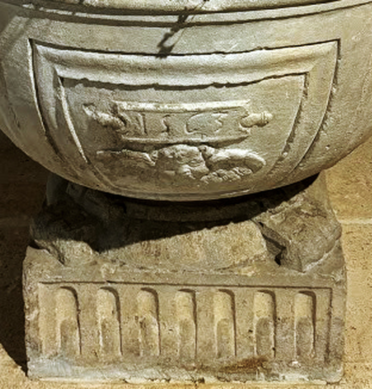 below the inscription