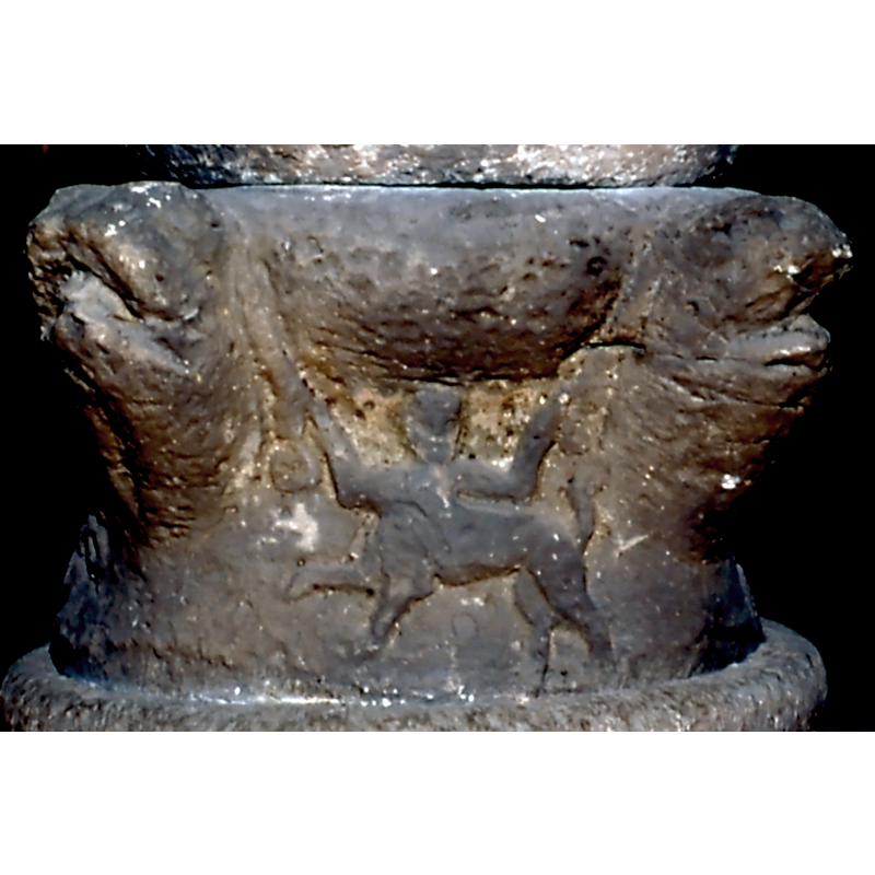 the arms of the centaur appear to generate the snake bodies that loop and interlace on the other sides of the base -- on the south side of the base [orietation is approximate]