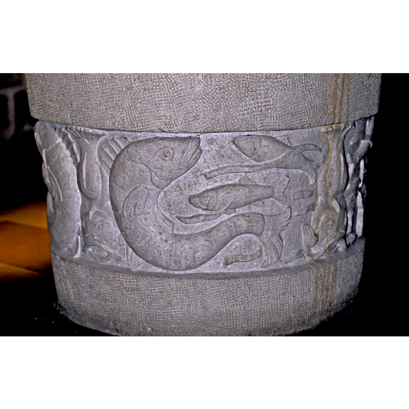 carved on the lower sides of the 20thC font in use