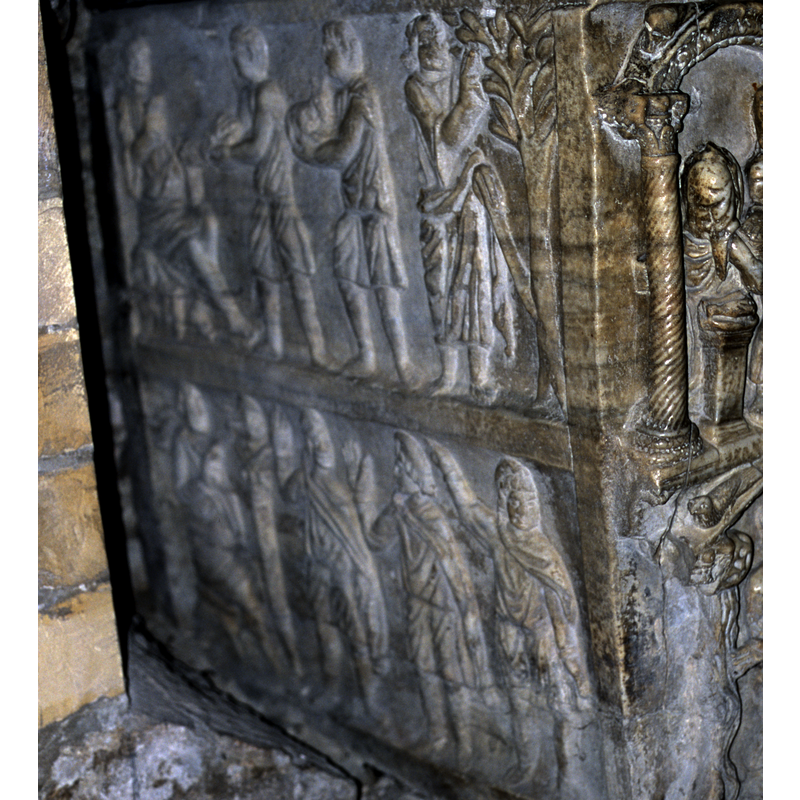 the left side is towards the west; the front faces south -- this side has two registers clearly separated by the frame