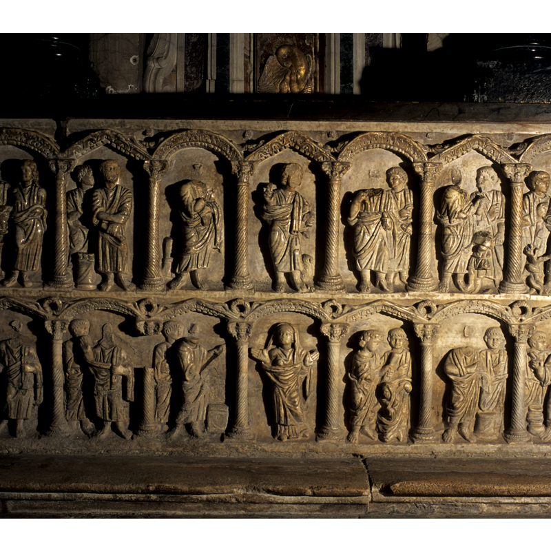 on the front side of the sarcophagus/altar/font, under the arches of the arcade; some single, some in pairs, both male and female