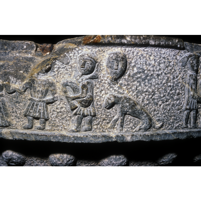 the figure appears to be part of the dancing scene with the two couples