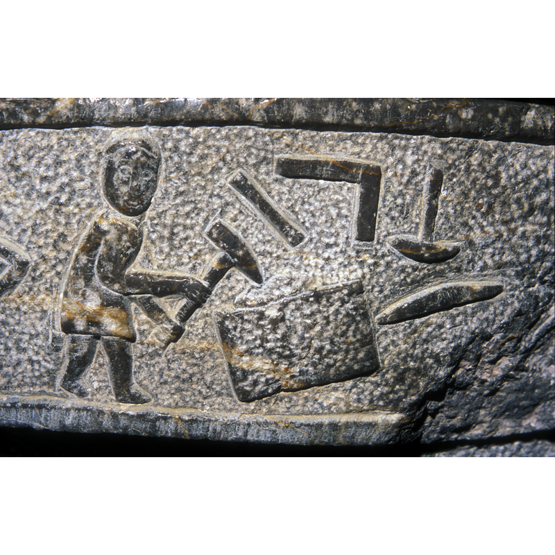 a portrait of the carver? his signature?