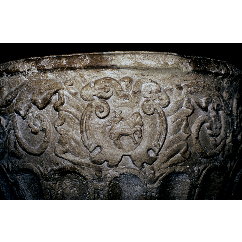 passant to the right; in a scroll and foliage frame, front side of the basin