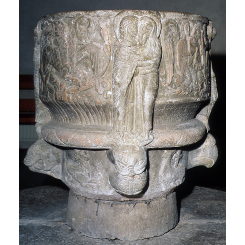 beneath Anna and Joachim -- Two heads of snakes (?), top head holds the snout of the lower head which is upside-down. The lower head is practically identical to that. They have ears - are they felines and not snakes?  [NB: Carlsson identifies them as seals]