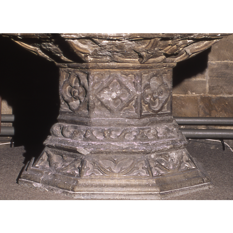 one on each side of the octagonal stem of the base