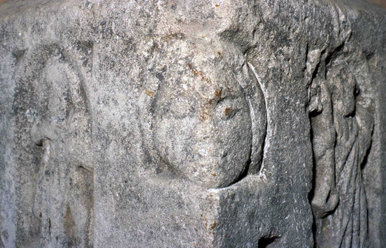 a 'normal' looking human head, as opposed to the other three