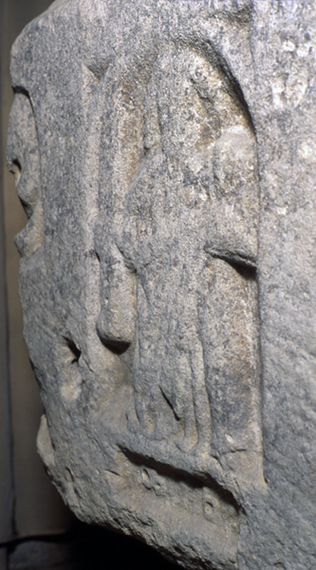 the figure has no "saintly" or Church head covering