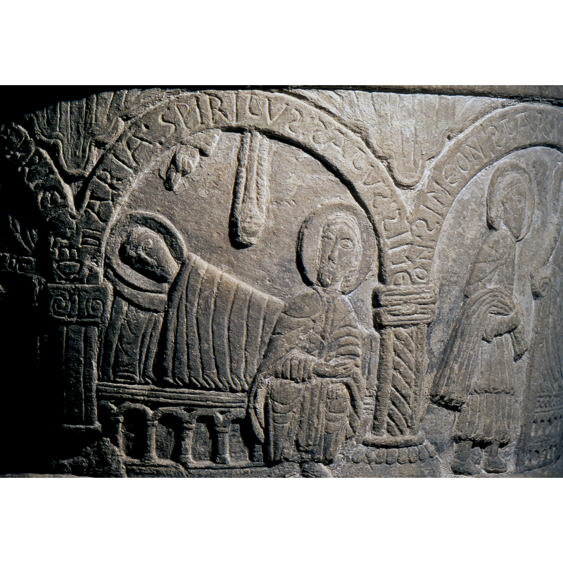 In the second arch the Virgin Mary reclines in bed, head to the left, and Simeon (according to the inscription over arch) sits full frontal. Above the Virgin Mary is the Hand of God  and a hanging light or censer.