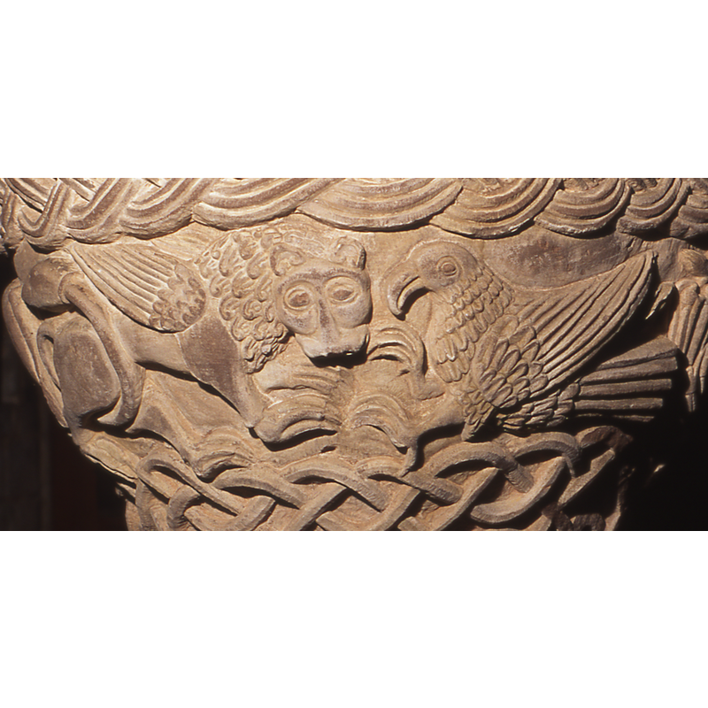 to the right of St. Luke's winged ox, facing right