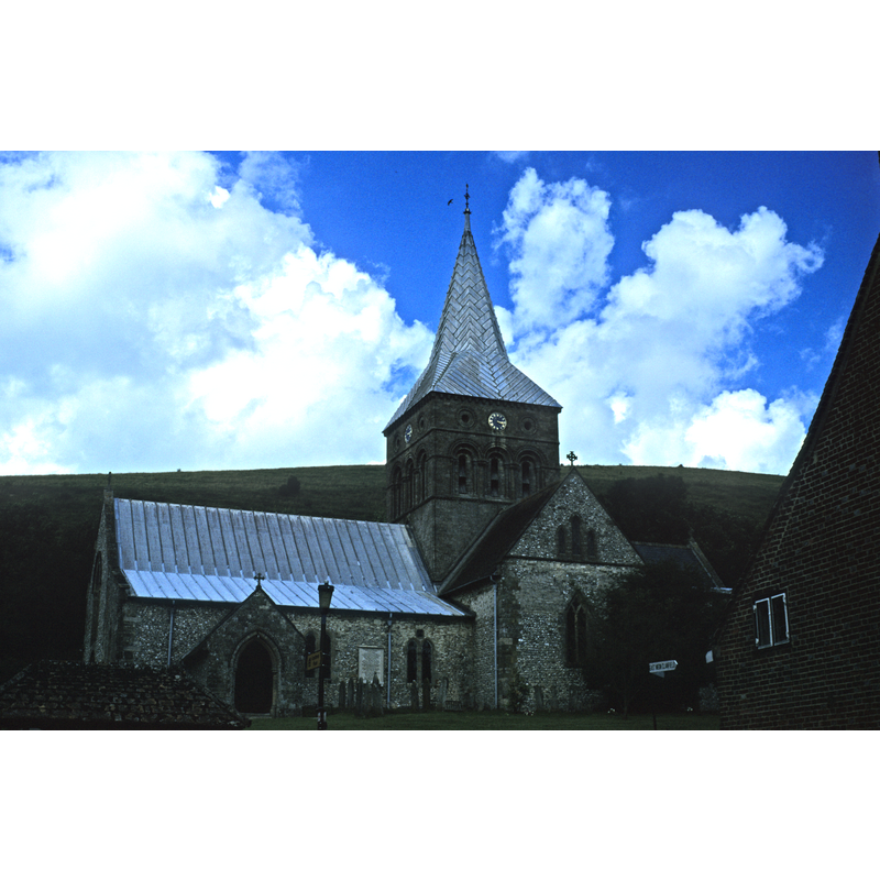 the tower is above the crossing; there is a west portal as well as the main south porch