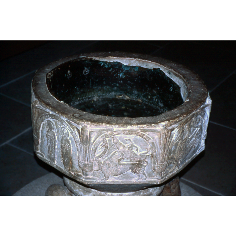 the old metal lining of the font