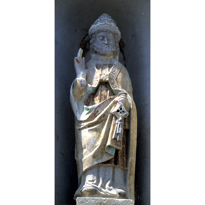 the patron saint of the ruined church in a niche of the side of the tower