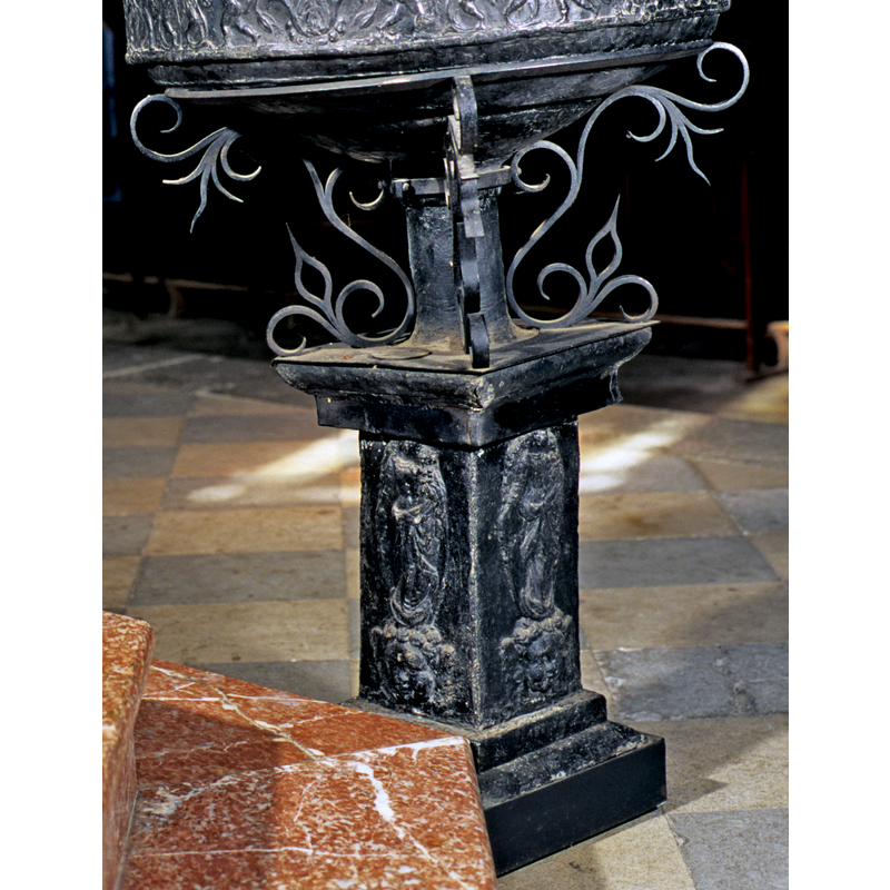 the square pedestal is made of marble -- the church is dedicated to the Assumption of St. Mary