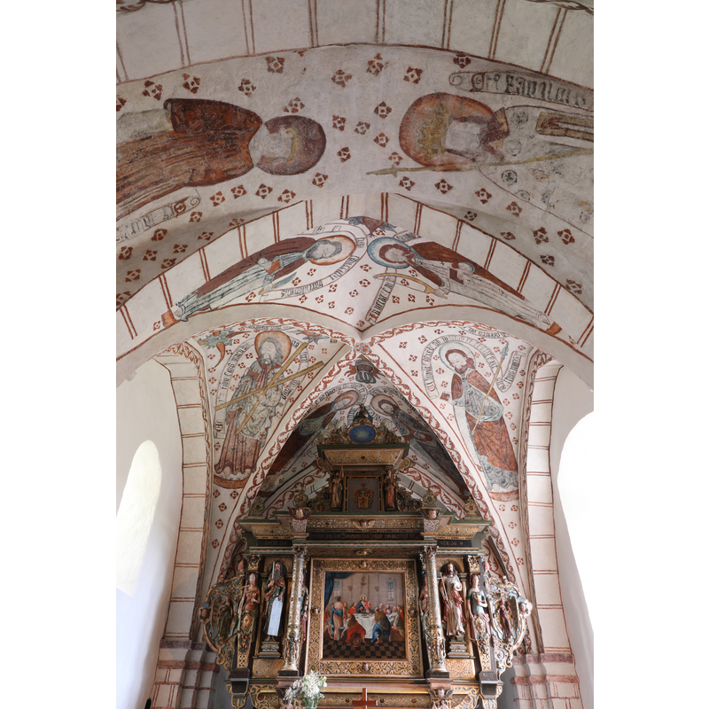 partially showing the two saints painted on the chancel arch