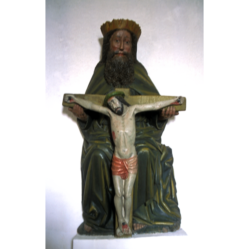 located in a wall niche, near the font