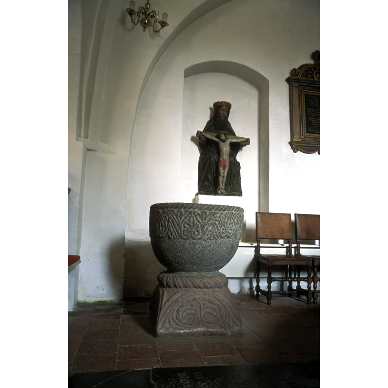 by the side of the north pillar of the chancel arch -- not its original location