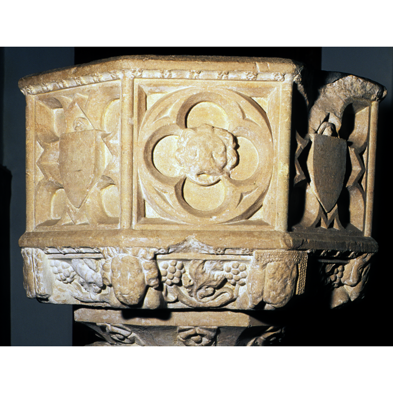 one with protruding tongue, another perhaps a Green Man, etc.
