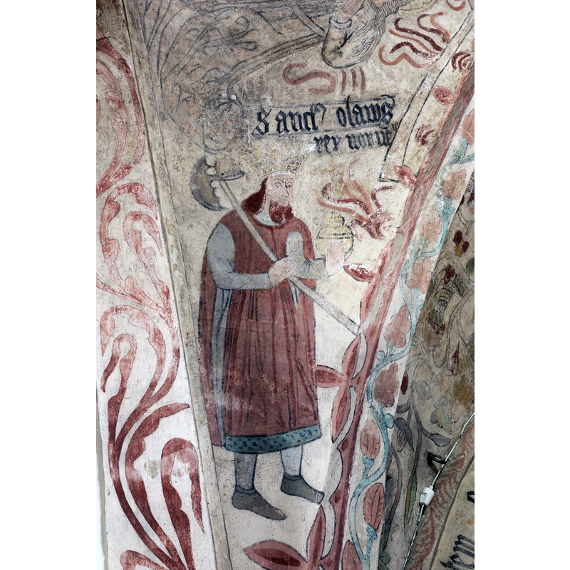 towards the east end of the nave, near the chancel: here is St Olav, king of Norway, crowned and holding a large ax on his shoulder