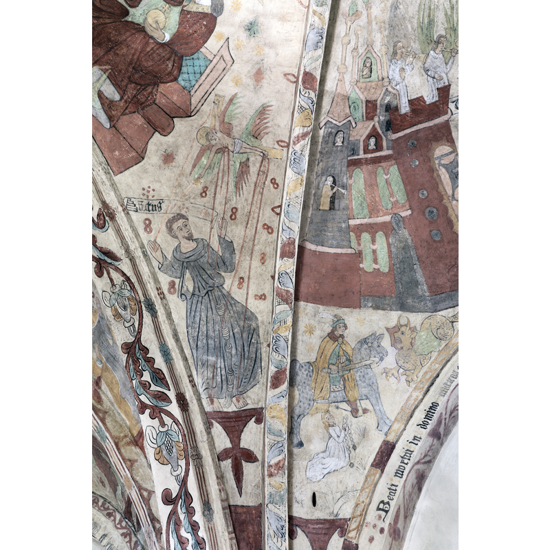towards the east end of the nave, near the chancel: here is St Francis -- although the painted scroll is missing his name the knotted cinculum provides the symbol for his identification