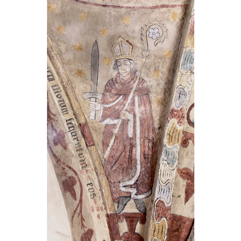 if the sword had been on his head it could have meant to depict Thomas Becket