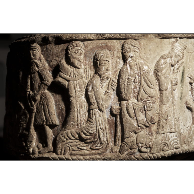 There are three figures, the one on the extreme left, in profile, hand vertical to the body and other holds his middle and carries a pack on  his back which is tied with a belt on his shoulders. The next figure, to the right is kneeling, and holding his hand with the other hand (gesture of sorrow?). Both figures looking to the right. On the right, full frontal, seated figure, left hand on book on left knee, and the right hand holds a long beard. He has long droopy mustach almost to the chest.