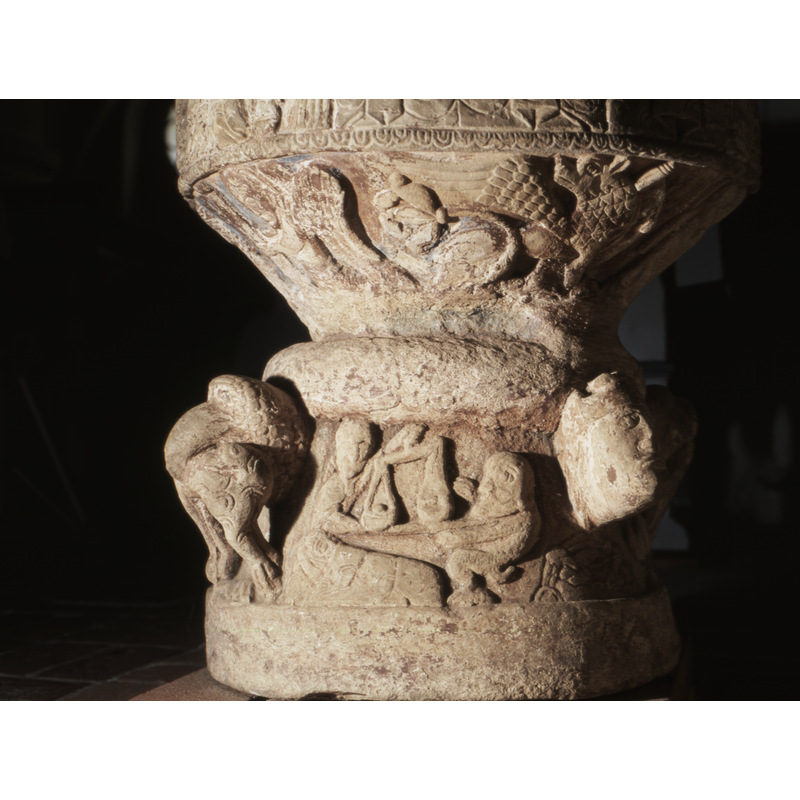 seen here on the left: the angel holds a large scroll.