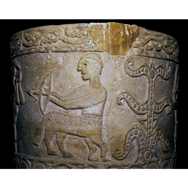 notice the large repair patch at the upper rim; it is located across from the large damage spot above the amphisbaena, and, like it, was probably caused by a metal staple from an old cover