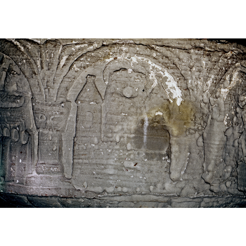 In the foreground, a castle with two towers (city of Jerusalem) with a Romanesque window in each - pointed roofs. Betweent he two towers, two figures, Elizabeth and Virgin, haloed and embracing.