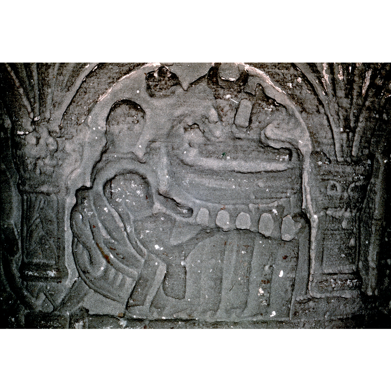 Nativity. In the forefront, a bed, with Mary lying - head to the left- the right hand is resting on her lap, the left appears to be holding her head. She is haloed, and design of bed is intricate. Behind Mary is Joseph - not haloed, and the hand is touching the baby or pointing to the manger. Above the bed of the Virgin, the manger (child on it with head to the left, swaddled) the bottom of the cradle is made of 5 arches and 6 columns. Above the baby the ox (left) and ass (right). To the left of the ox and above the figure behind the Virgin, the star. Mary's cuff is very long.