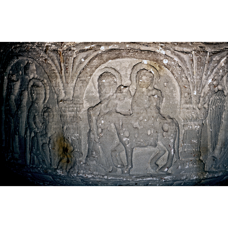 Flight to Egypt. Scene faces left. Mary and the Child riding the horse, full frontal, both haloed, and baby to the right side of the virgin. To the right and behind the horse's head walks Joseph, haloed and bearded and holding a staff over his shoulder with saddle bags.