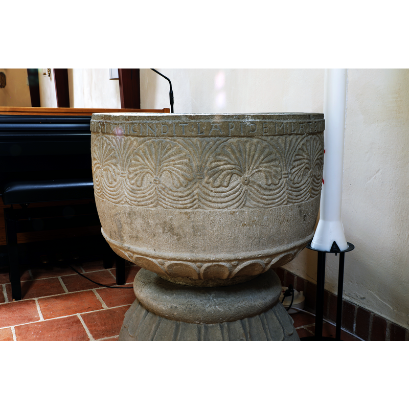 showing part of the inscription below the upper rim