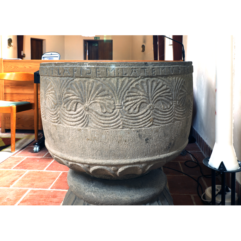 showing part of the inscription below the upper rim