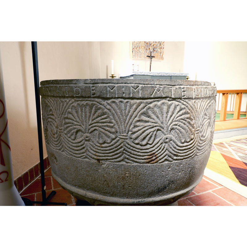 showing part of the inscription below the upper rim