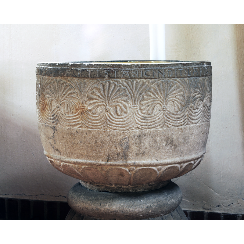 showing part of the inscription below the upper rim