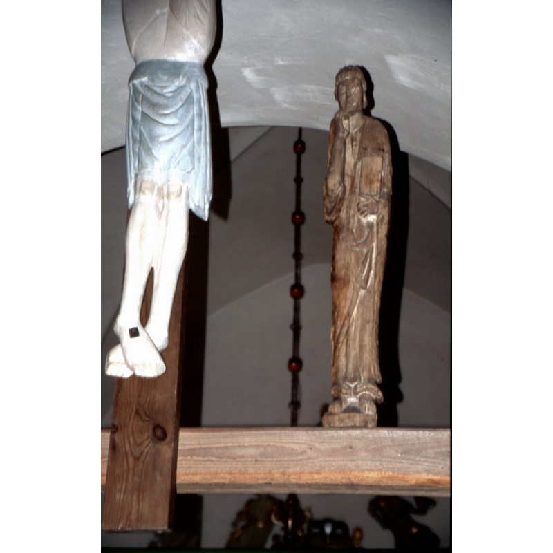 the two figures, Mary and John are carved in linden wood and dated ca.1200; the present Crucifix is a later work