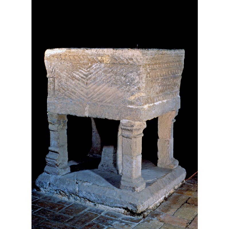 on the legs of the base; notice that the one on the left here appears to have been set upside down