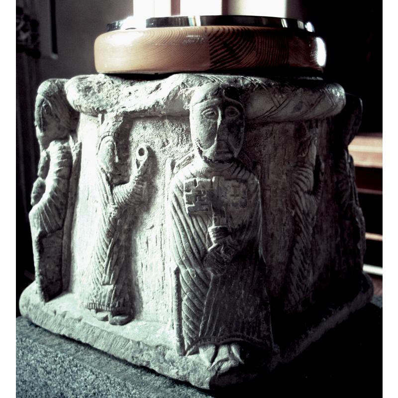 the re-designed font using the old base -- Peter charged with the keys at the centre; two of the Magi on the sides; Father Abraham at the far left corner; the Madonna and Child at the far right corner