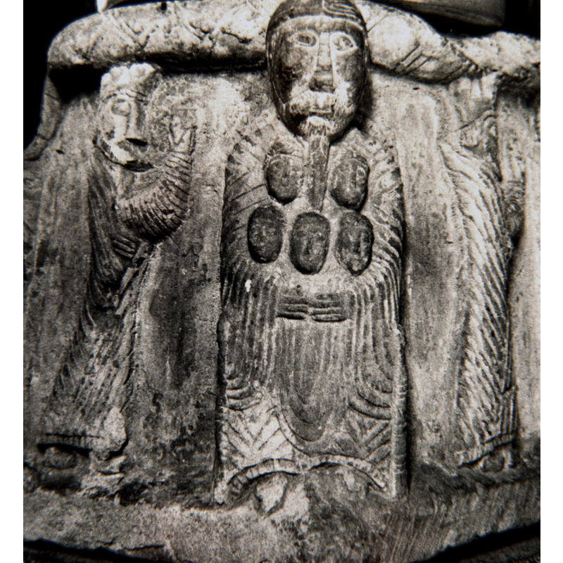 Father Abraham. Holds five souls, in his lap, sits in a high back chair - unlike the Gotland fonts, full beard, oriental beard.