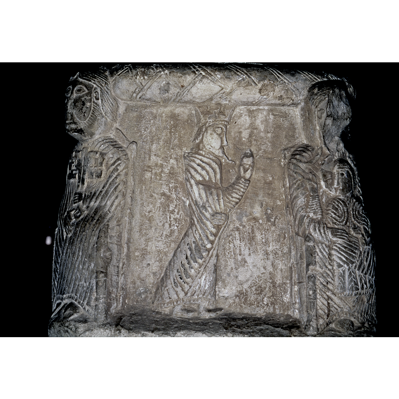First of three magi, crowned, bearded, walking in profile to the righ -- seen here to the left of the Madonna and Child