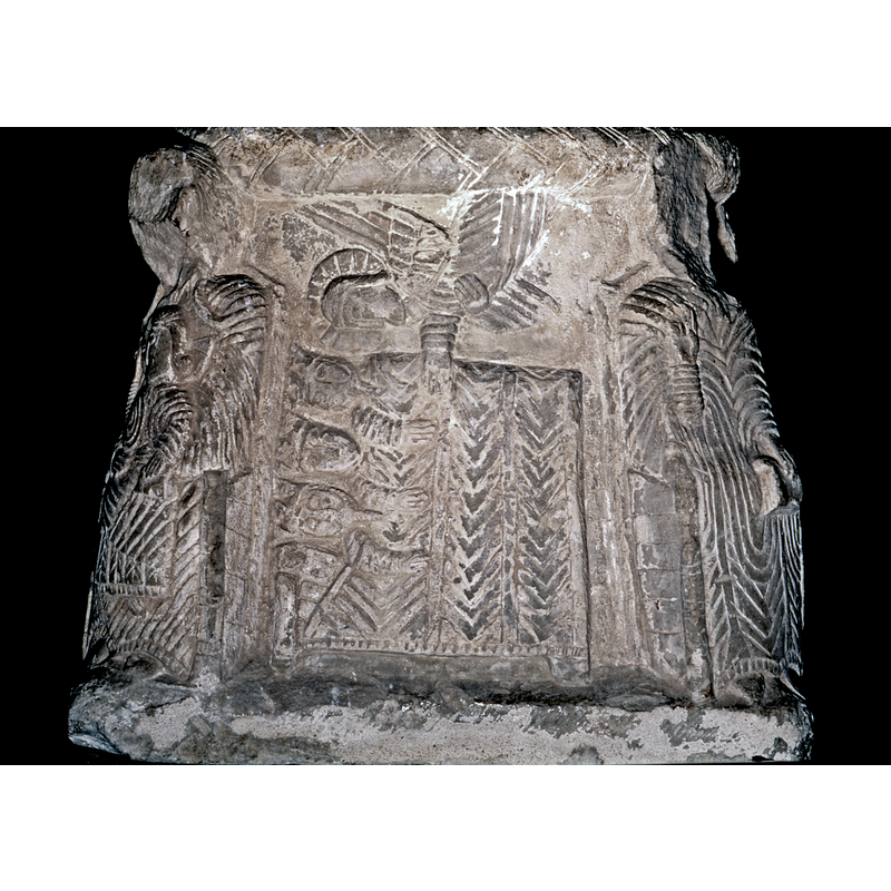 The side of the base, Dream of the Magi.(between Madonna to left, and Bishop to the right) Three heads to the left, crowned; two have long oriental beard, a youthful magus in the middle; their right arms stick out of the blankets; angel above, haloed, no cloud, the right hand points to kings, and the left hand holds mantel.